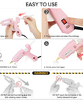Full Size Dual Power Hot Glue Gun With 60W 100W Settings Preheats Fast For Pro Crafting DIY Jobs Includes 21 Glue Sticks And Storage Case Heavy Duty Pink, pink glue gun in use with trigger and power switch