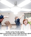 LED Garage Light With Five Adjustable Panels, 100W 8000LM Deformable Ceiling Light illuminating a family in a kitchen.