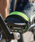 Foot secured in bike pedal using Two Pack Green Bike Pedal Straps For Stationary Bikes Anti Slip Foot Straps Toe Clips scenario