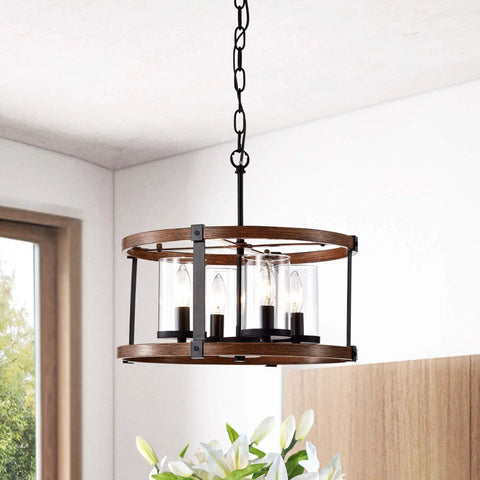 Akua Imitation Wood Grain Matte Black Four Light Drum Chandelier with modern frame and glass accents hanging in room.