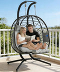 Cozy Double Hanging Egg Chair For Two With Adjustable Footrest And Stand, Indoor Outdoor Wicker Swing With Cushions in grey on patio