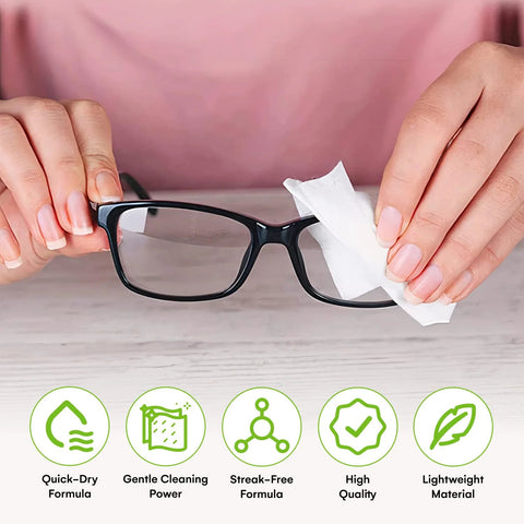 Care Touch eyeglass lens wipes being used to clean black-framed glasses with a white wipe