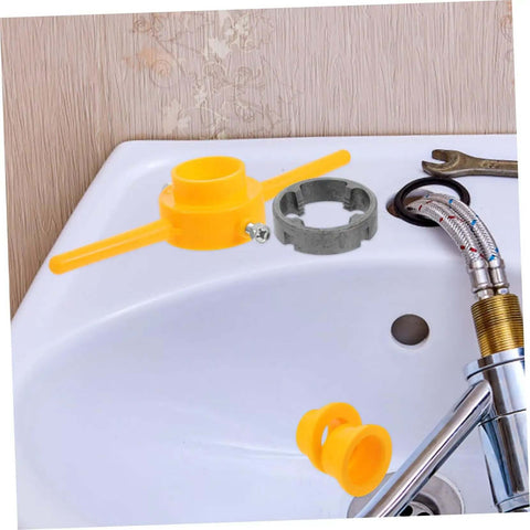 Pipe threading tools from Hardcore Pipe Threader Kit For Plumbing Projects placed on sink with wrench and hoses, ready for use.