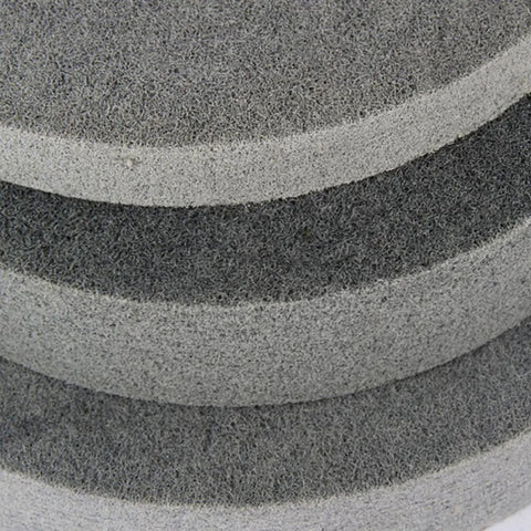 Close-up of Pro Grade Nylon Fiber Polishing Wheel and Buffing Disc for Metal and Wood showing texture of heavy-duty pad.