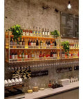 Slick Wall Mounted Metal Wine Rack And Glass Dryer Built Tough For Heavy Bottles Space Saving Home Bar Display showing organized bottles and glasses.