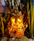 Epic Outdoor Solar Lantern With Realistic Flickering Flame From Resin Tree Stump Decor set among outdoor foliage.