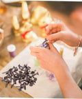 Hands using 50 Pack Miniature Metal Fasteners and Close Pins for Scrapbooking Card Making and Craft DIY Brads Paper Fasteners