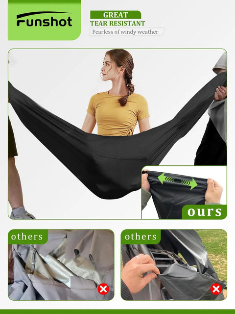 Woman testing tear resistance of black waterproof double egg chair cover for outdoor hanging swing seats, 91 by 80 inches.