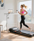 Portable Treadmill Walking Pad Desk On Wheels With Height Adjustable Stand Up Table For Home Office next to woman running