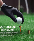 Gloved hand placing golf ball on Birch Wood Golf Tees Value Pack 100 Count With 80 Regular Tees In Two And Three Quarters Or Three And A Quarter Inches And 20 Short One And A Half Inch Driving Range Tees Tan Color 5X More Durable 5X Stronger Less Friction For Consistent Drives on grass