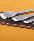 Leather Stitching Punch Kit With White Steel Prongs 5mm Pitch 1 2 4 6 Prong Tools on brown leather surface