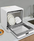 1.8 Gallon Countertop Dishwasher In White With Four Wash Modes And 360 Degree Spray Arms for thorough cleaning with plates inside.