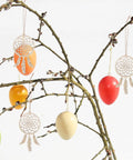 Wooden Dream Catchers DIY Kit With Hollow Design 50 Pcs Boho Style Wood Pendants For Creative Activities And Bedroom Wall Decor Fun Craft Supplies For Painting Crafting And Kids Projects hanging on branches with colored eggs