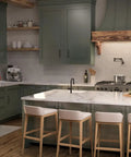 Modern kitchen with hansgrohe Talis N Pull Down Kitchen Faucet, Magnetic Hand Sprayer, and green cabinetry.