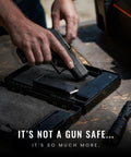 Close-up of hands placing a handgun into a Compact Mechanical Handgun Lock Box For Instant Access Portable Safe Case, TSA compliant.