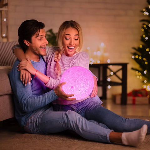 Couple holding Moon Lamp 3D Printed Lunar Light with Black Stand 3.5 Inch Night Light USB Charging in cozy living room