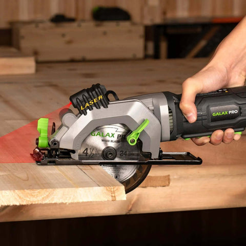 Side view of GALAX PRO 4-1/2in circular saw with laser guide cutting wood.