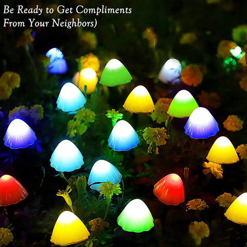 Mushroom Solar String Lights 20-Pack, 37.7ft Fairy Color Changing Outdoor Pathway Lights With 8 Modes lighting up a garden at night.