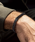 Man wearing Black Stainless Steel Cuban Link Chain Bracelet For Men And Women 7mm Rope Chain With Fold Over Clasp