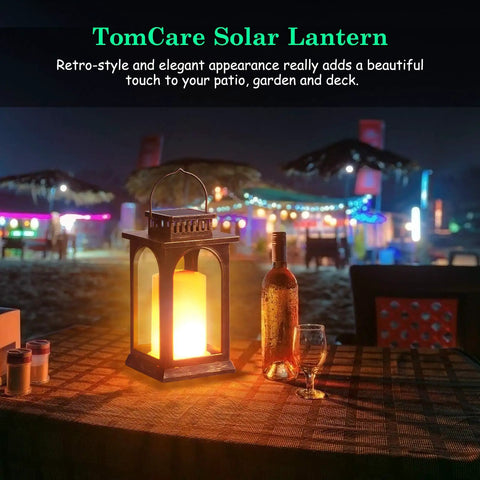 Lit Outdoor Solar Lantern With Realistic Flickering Flame on table, patio setting, decorative metal lantern, ambient lighting
