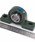 Two Pack Pillow Block Bearings UCP206-19 Bore 1-3/16 In with cast iron base and ruler for scale