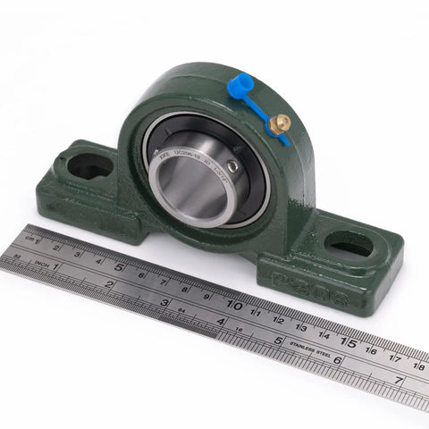 Two Pack Pillow Block Bearings UCP206-19 Bore 1-3/16 In with cast iron base and ruler for scale
