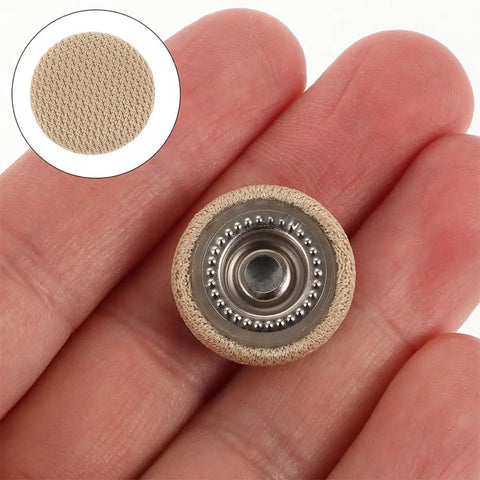 Close-up of a hand holding a beige rivet from 30 Piece Car Headliner Repair Kit With Roof Rivets And Installation Tool For Beige Flannel Car Roof Liner Fix Pins Interior Ceiling Fabric Retainer Clips DIY Friendly Quick Fix