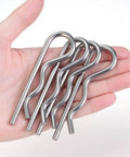 Hand holding 6 Pcs M4 X 90 Heavy Duty 304 Stainless Steel Cotter Pins And R Clips With Strong Spring Tension, rust resistant.