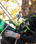 Person using Rope Grab With Three Friction Settings And One Hand Operation For 11 To 13mm Lines, climbing safety gear visible.
