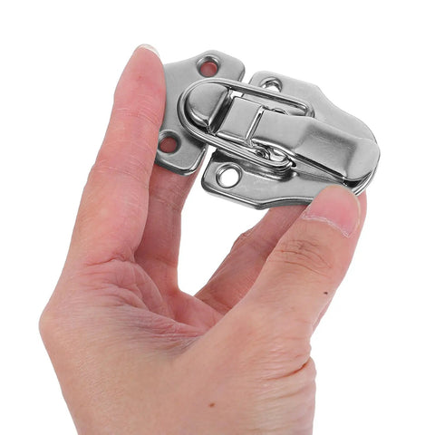 Close-up of a hand holding one silver latch from Six Piece Vintage Iron Jewelry Box Latch Hasps With Screws For Wooden Boxes Retro Chest Lock Buckles To Protect Valuables And Boost Security With Old School Style Hardware