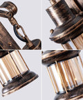 Close-up of Rustic Oil Rubbed Bronze Wall Light Fixtures With Glass Shades showing detailed cast iron and glass design.