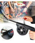 Hand Cranked Portable BBQ Fan and Campfire Bellows to Amp Up Yard Flames Fast With Durable Metal Body and Effortless Pump Design for Weekend Cookout Sessions in use at a BBQ.