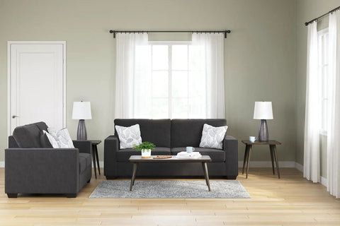 Living room with Shavontae Modern Table Lamps Set Of 2 27.5 Inch Gray Resin Bases and White Fabric Drum Shades on end tables.