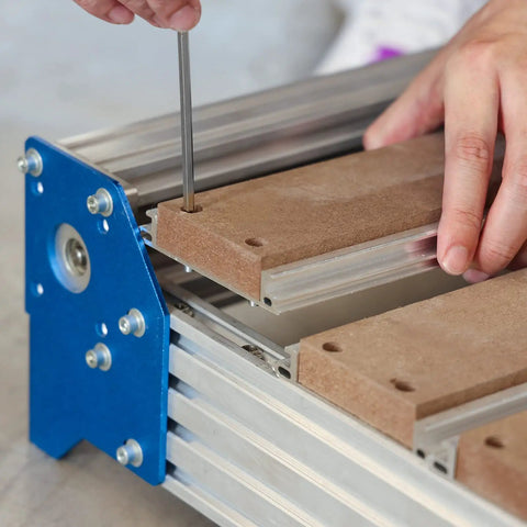 Person assembling Hybrid Aluminum And MDF Spoilboard Table for CNC Router Upgrade Compatible with PROVerXL 4030 to 6060 XY Axis