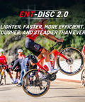 Cyclist performing a wheelie with ENT Disc 2.0 Carbon Wheelset For Road Bikes, 700c Carbon Rim, Center Lock Disc Brakes