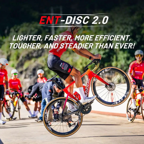 Cyclist performing a wheelie with ENT Disc 2.0 Carbon Wheelset For Road Bikes, 700c Carbon Rim, Center Lock Disc Brakes