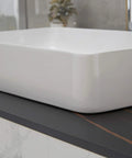 Close-up of Vessel Sink and Pop Up Drain Kit, 24 By 14 Inch Rectangular Above Counter White Porcelain Ceramic Bathroom Vanity Basin