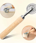 Front view of Amazon kitchen pastry wheel cutter with wooden handle and fluted stainless steel wheel for dough.