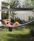 Heavy Duty Camping Hammock With Rain Fly Tarp And Mosquito Net 440 Lb Capacity Portable Tree Hammock in use outdoors