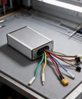 H5 Electric Scooter Controller 18A Mainboard With Aluminum Alloy Case Plug And Play Replacement Part on workbench