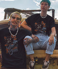 People wearing gothic streetwear shirts and Stainless Steel 316L Barbed Wire Choker Necklace For Women And Men Gothic Thorns 16 Inch Chunky Punk Jewelry Unisex Alternative Fashion Statement Piece Durable Heavy Duty Chain in an industrial setting.