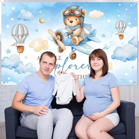 Airplane Baby Shower Banner With Little Explorer Vibe And Hot Air Balloons Boy Shower Backdrop 6 By 3 Point 6 Ft Photo Background Easy Hang Decor For A Fun Kid Friendly Party featuring a couple holding baby clothes
