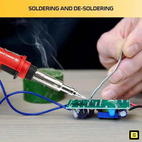 Cordless Butane Soldering Iron Kit in use, soldering a circuit board for electronics repairs, hand holding wire.