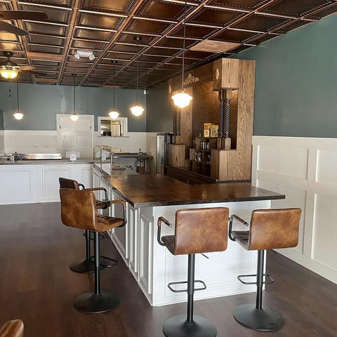 From Plain To Beautiful In Hours Aged Copper Tin Look PVC Ceiling Tiles 2x2 Ft Lay In Or Glue Up Covers 40 Sq Ft in a restaurant setting
