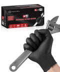 Hand wearing 8 Mil Heavy Duty Nitrile Gloves With Beefy Raised Diamond Texture Grip holding wrench, box in background.
