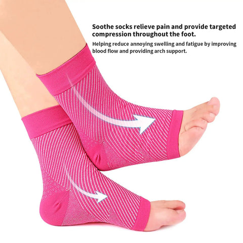 Close-up of feet wearing pink compression socks for pain relief, showing directional arrows, highlighting ankle and arch support.