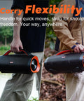 Extreme Boom Pro 100W Outdoor Speaker with dual 40W woofers and dual 10W tweeters shown being carried with handle and strap