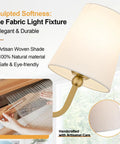 Top Tier Three Light Brushed Gold Vanity Lights With Flared White Fabric Shades Smooth bathroom fixture with woven shade detail.