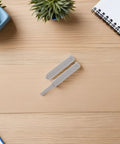 Push To Open Cabinet Latch Set 4 Pack on wooden table with plants and notebook