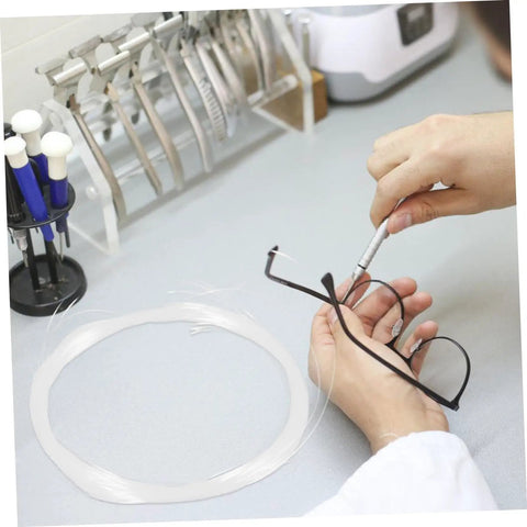Person repairing glasses using a Glasses Repair Thread Kit For Half Frame Eyewear Lanyard And Wire Repair Tool with stainless steel thread.